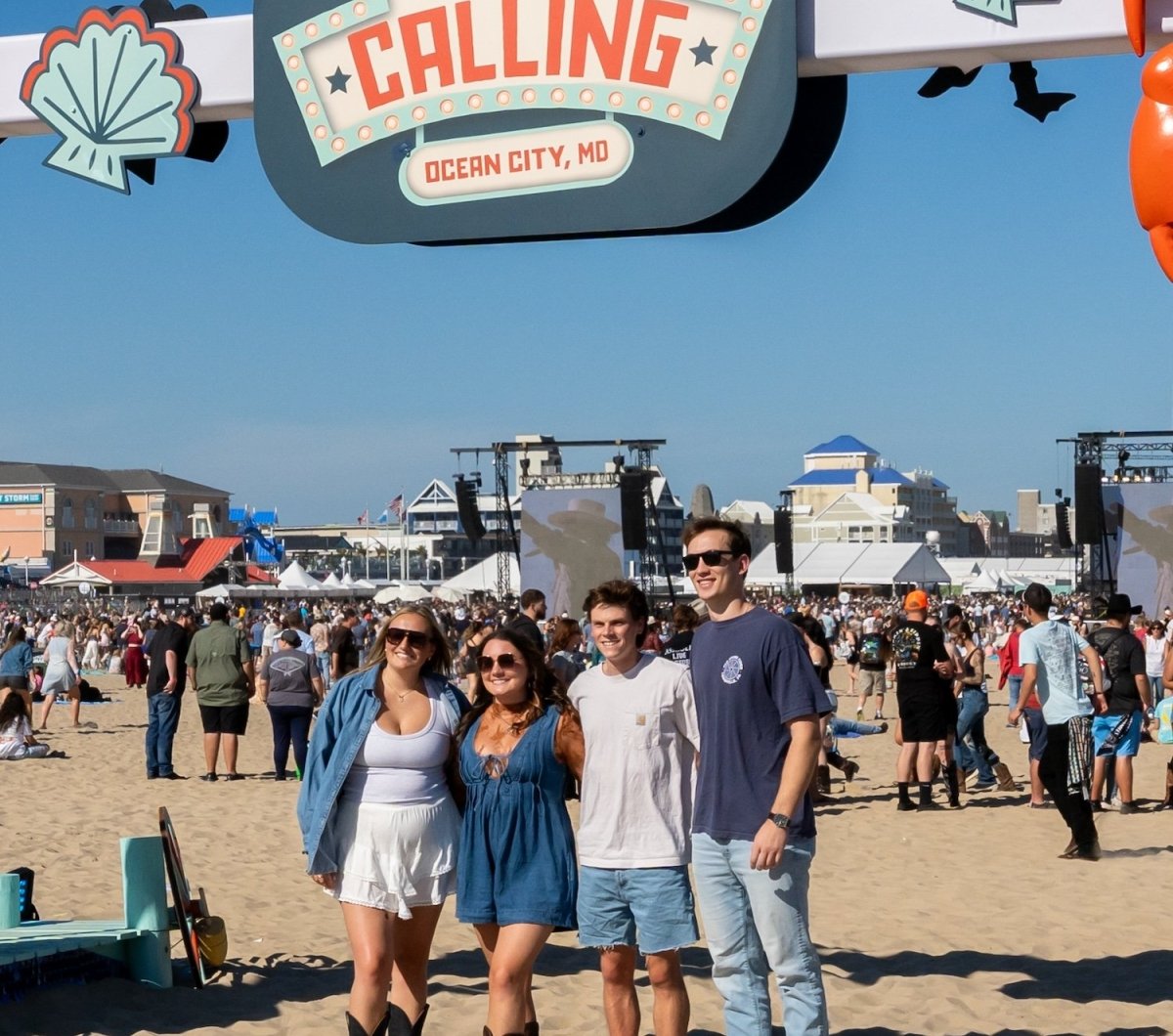 Country Calling Sign Group posing at a sign for Country Calling